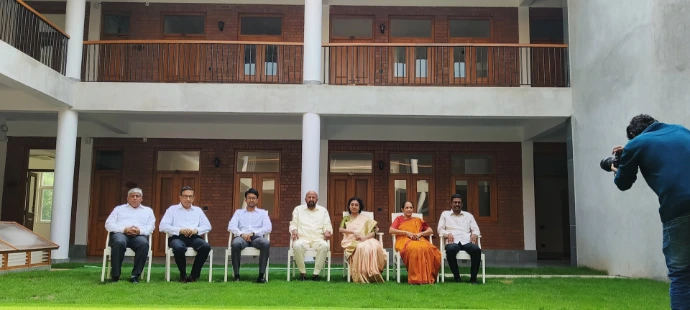 a group of people sitting outside a building